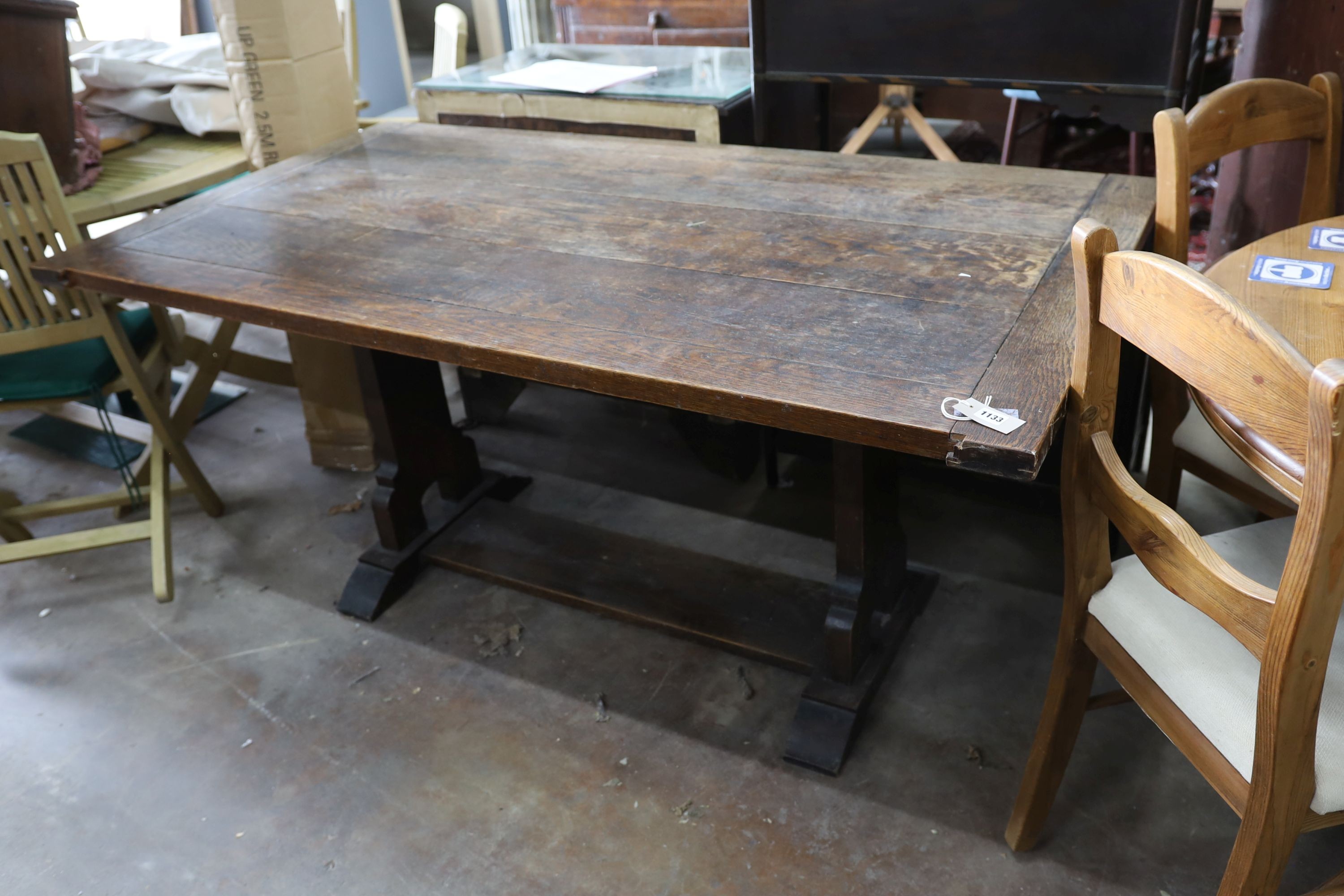 A rectangular oak cleated planked top refectory dining table, length 165cm, depth 91cm, height 76cm